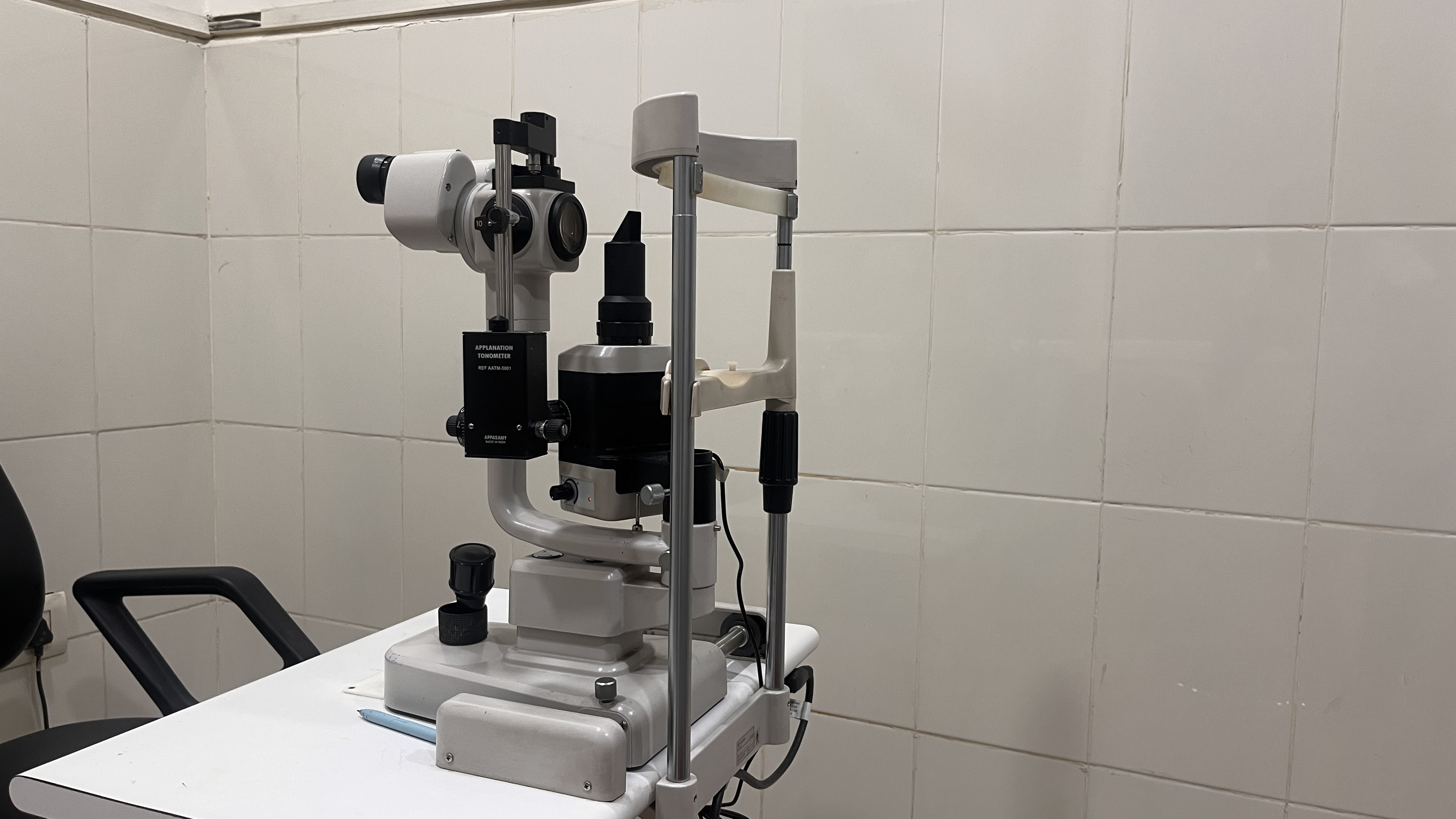 Goldmann Applanation Tonometer mounted on Topcon